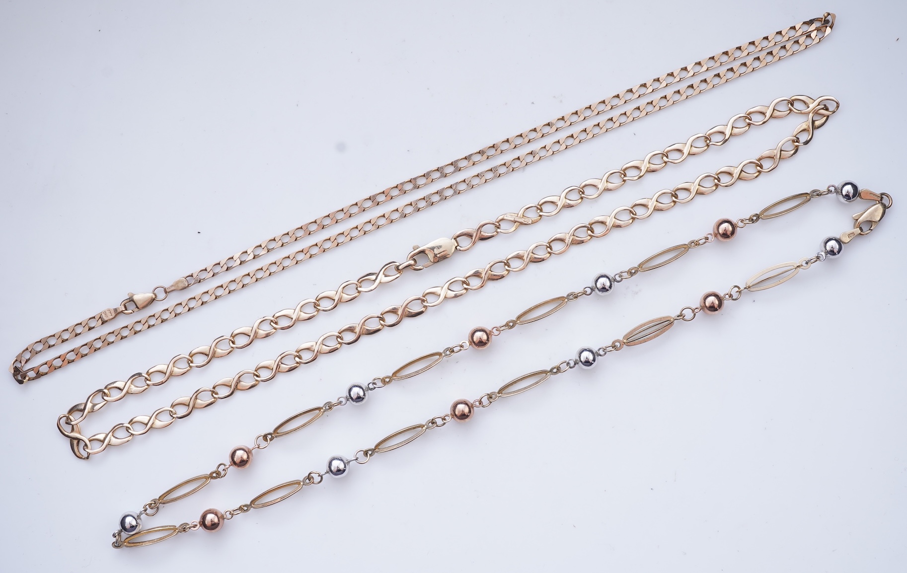 Three gold necklaces